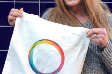 Sally holding our new tote bag