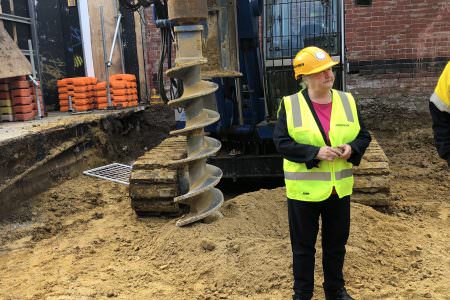 Jude Munro inspecting works on site at the Victorian Pride Centre