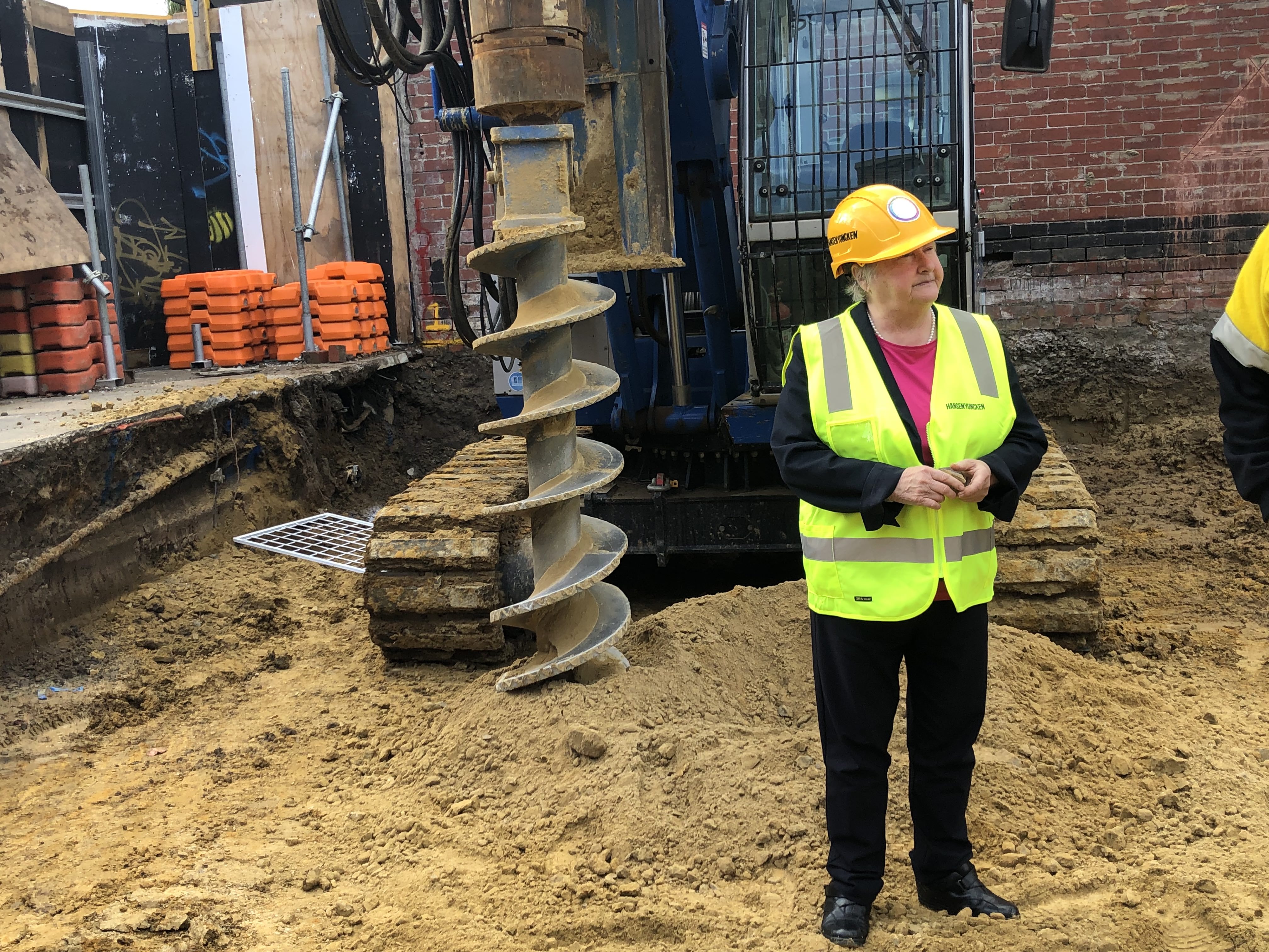 Jude Munro inspecting works on site at the Victorian Pride Centre