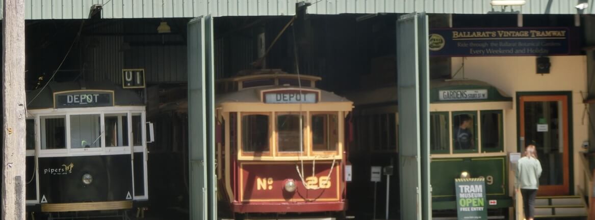 Three trams with titles 'depot' at Ballarat's Vintage Tramway