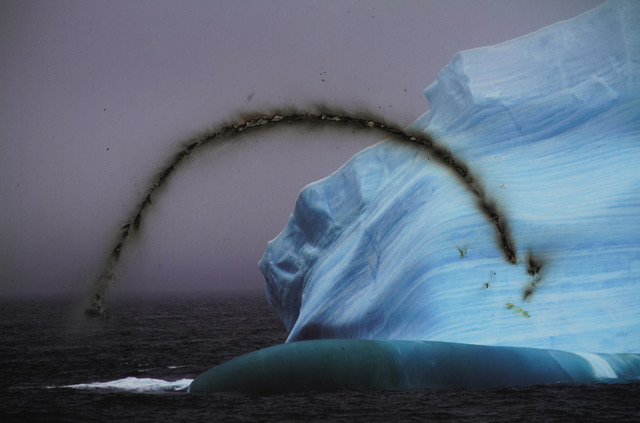 Burn mark across image of melting iceberg
