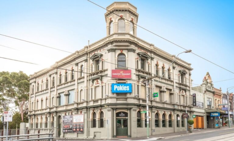 A corner hotel with 'Carlton Draught' and 'Pokies' written on the front