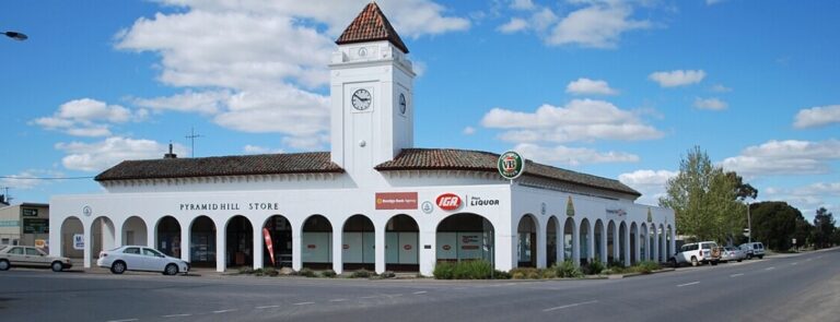 Long shot of the Pyramid Hill Store on the corner of two quiet intersections