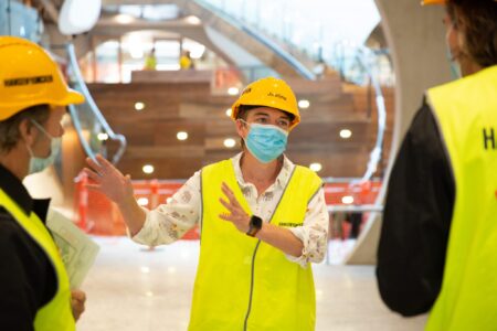 Justine showing a tour through the constructed building