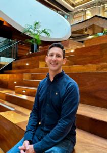 Headshot of Paul Horwell on the stairs of the VPC Atrium