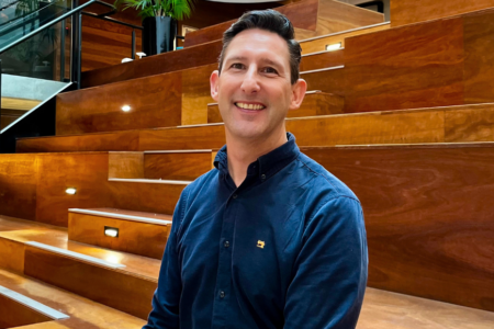 Headshot of Paul Horwell on the stairs of the VPC Atrium